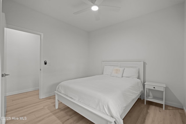 bedroom featuring ceiling fan and light hardwood / wood-style flooring