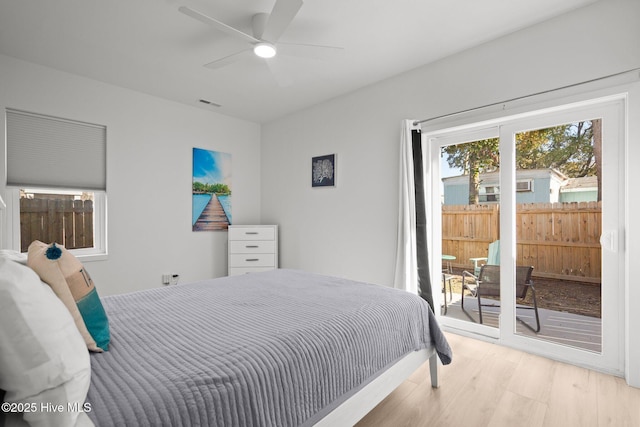 bedroom with ceiling fan, light wood-type flooring, and access to outside