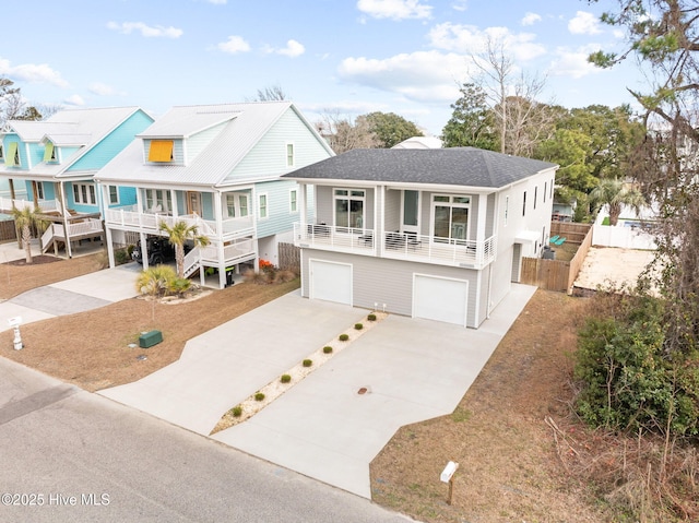 view of front facade with a garage and covered porch