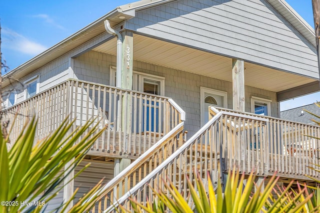 view of exterior entry with a porch