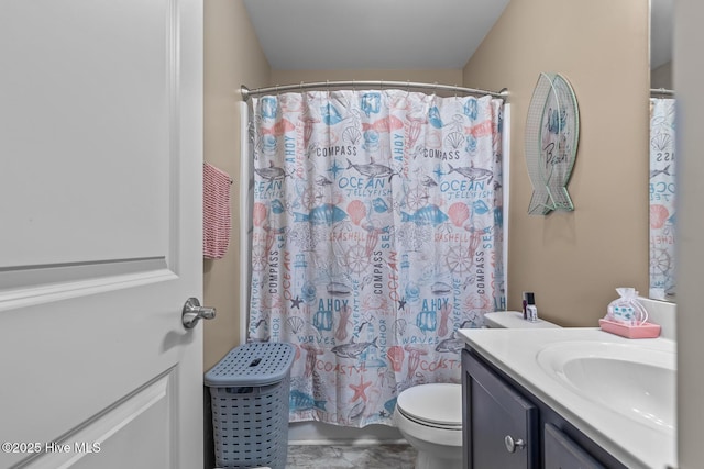 bathroom featuring vanity, toilet, and a shower with shower curtain