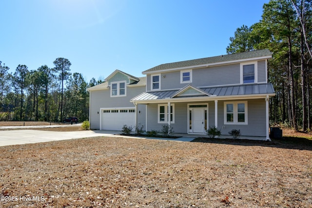 view of front property with covered porch and a garage