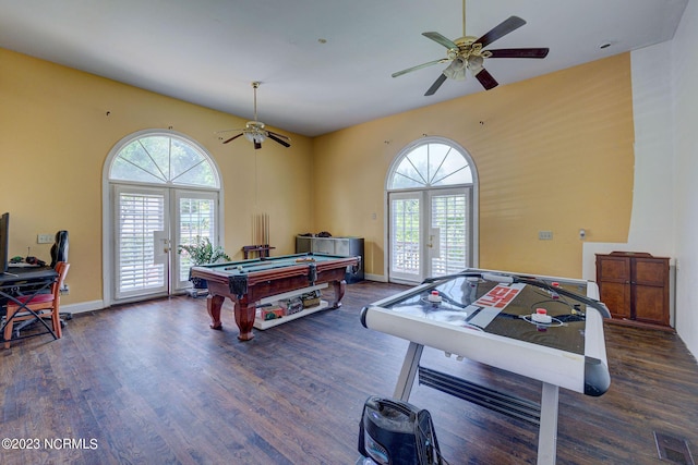 playroom featuring dark hardwood / wood-style floors, a wealth of natural light, french doors, and ceiling fan