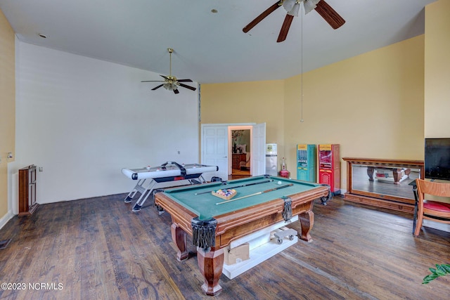 game room featuring a towering ceiling, billiards, dark hardwood / wood-style floors, and ceiling fan