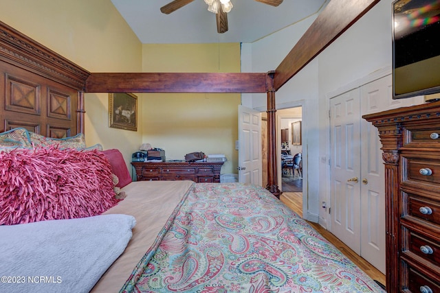 bedroom featuring ceiling fan, a closet, and light wood-type flooring