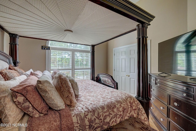 bedroom featuring crown molding