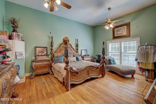 bedroom with ceiling fan and light wood-type flooring