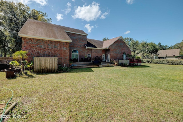 back of house featuring a yard