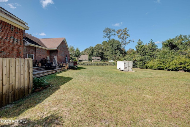 view of yard featuring a wooden deck