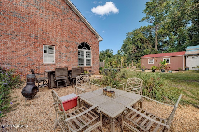 view of patio / terrace featuring an outbuilding