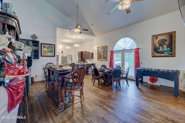 dining room featuring high vaulted ceiling, dark wood-type flooring, and ceiling fan