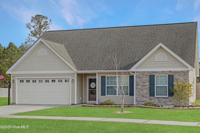 view of front facade with a garage and a front lawn