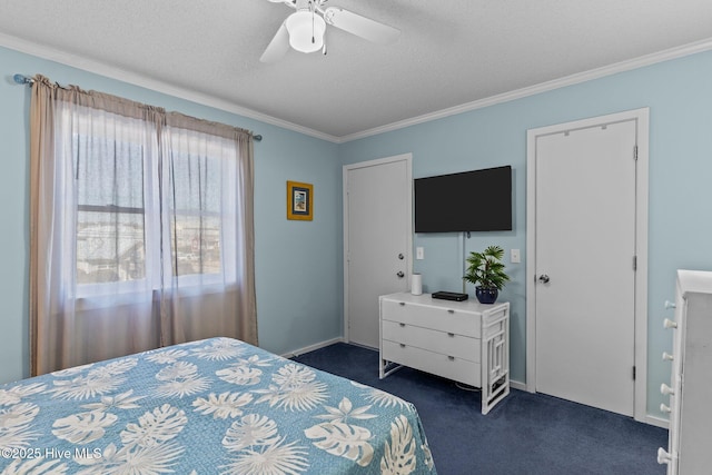 bedroom with ceiling fan, crown molding, a textured ceiling, and dark colored carpet