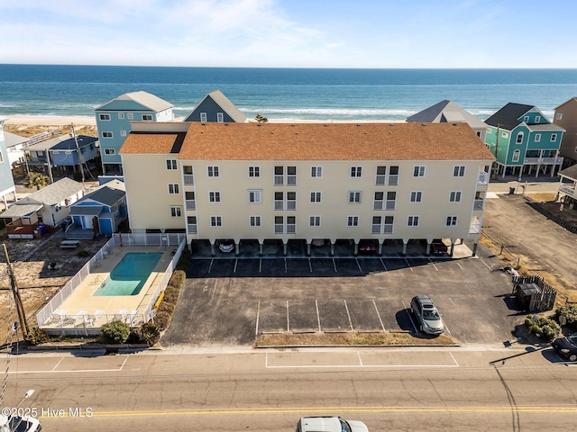 bird's eye view with a water view and a view of the beach