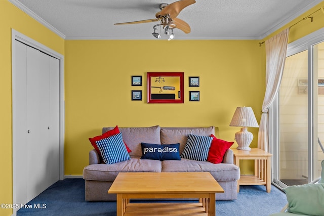 carpeted living room with ceiling fan, ornamental molding, and a textured ceiling