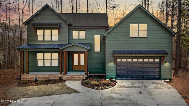 modern inspired farmhouse with a garage