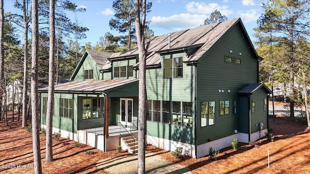 view of front of house with a sunroom