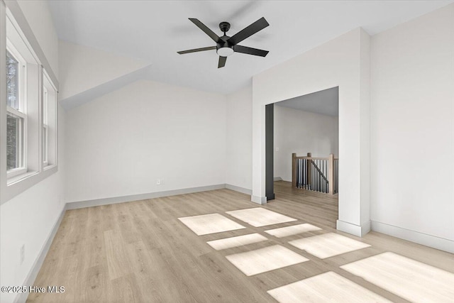 empty room with ceiling fan and light wood-type flooring