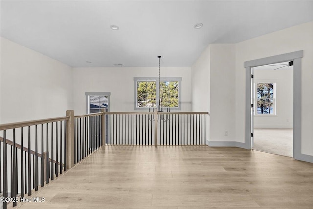 corridor featuring light hardwood / wood-style flooring