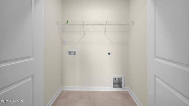 washroom with hookup for a washing machine, laundry area, electric dryer hookup, and baseboards