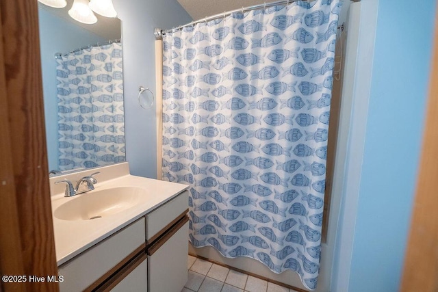 bathroom with tile patterned flooring, vanity, and a shower with curtain