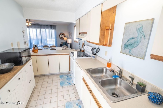 kitchen featuring sink, white cabinetry, light tile patterned floors, kitchen peninsula, and white range with electric stovetop