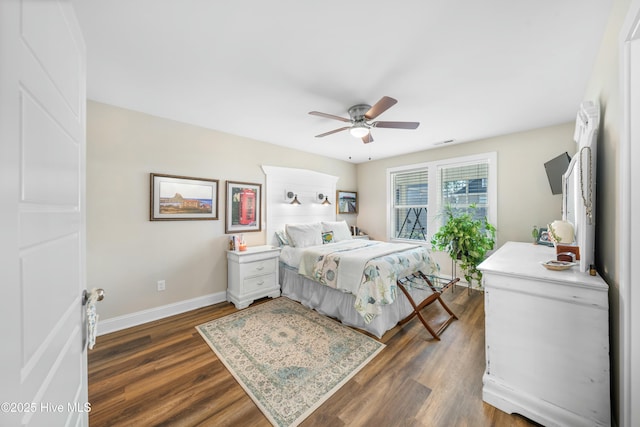 bedroom featuring ceiling fan and dark hardwood / wood-style flooring