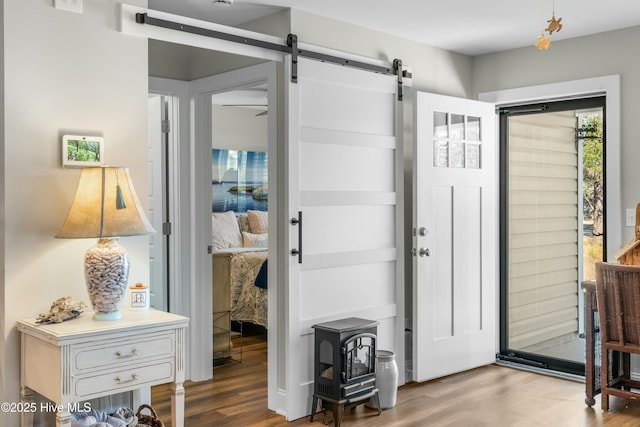 entryway featuring hardwood / wood-style flooring and a barn door