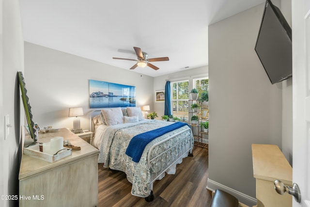 bedroom featuring dark hardwood / wood-style floors and ceiling fan