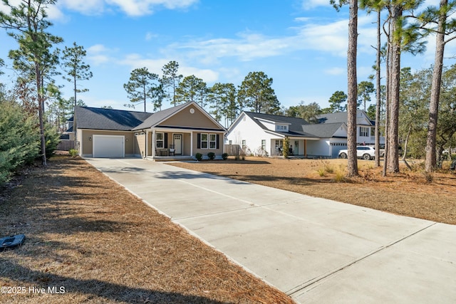 view of front of home with a garage and a front lawn