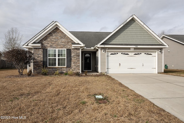 view of front of home featuring a garage and a front yard