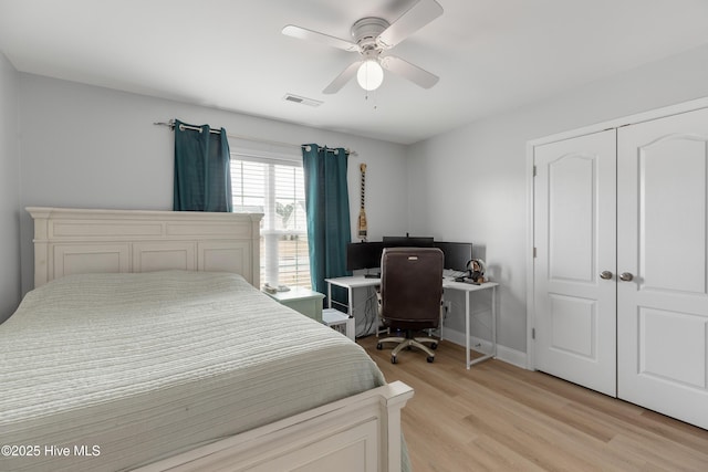 bedroom featuring light hardwood / wood-style floors, a closet, and ceiling fan