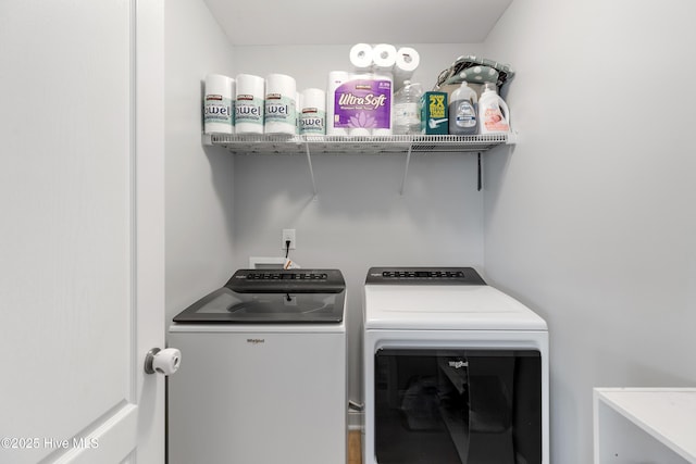 clothes washing area with independent washer and dryer