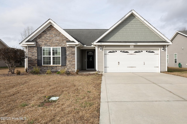 view of front of home with a garage and a front yard