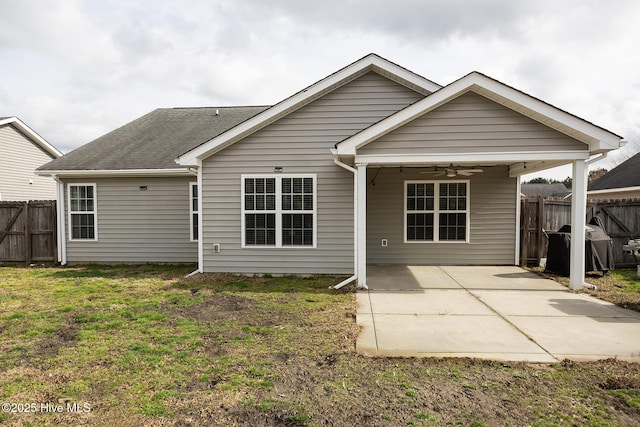 back of house featuring a yard, ceiling fan, and a patio area