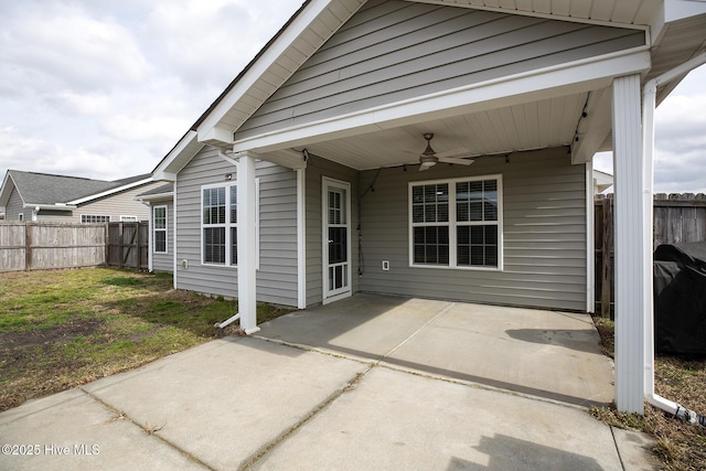 exterior space with ceiling fan