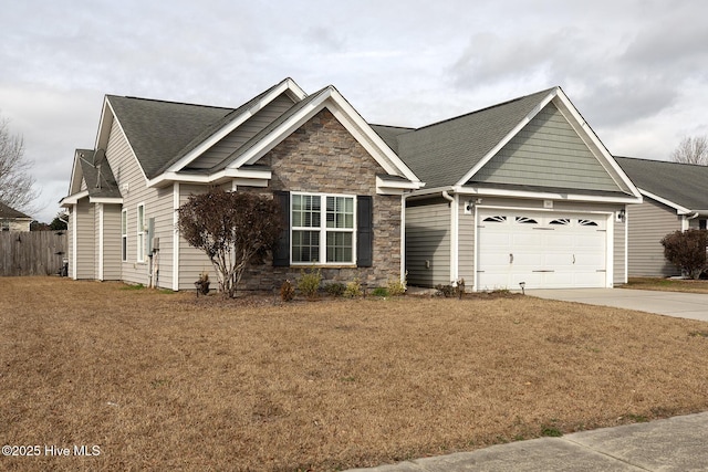 view of front of home featuring a garage and a front yard