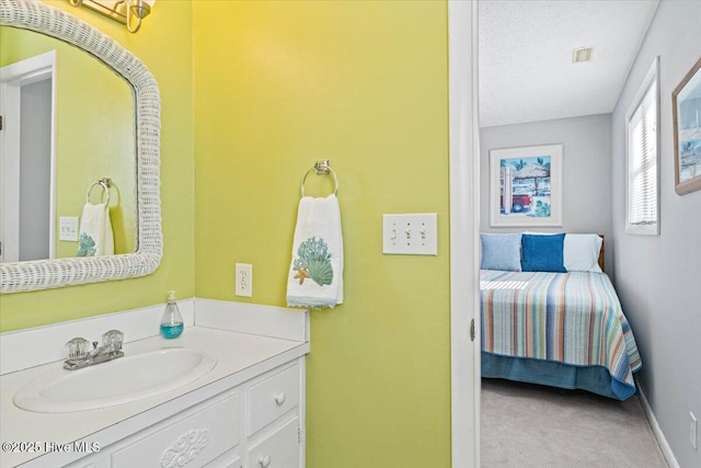 bathroom featuring vanity and a textured ceiling