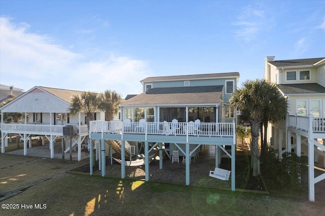 back of property featuring a wooden deck and central AC