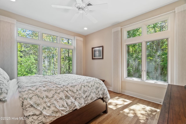 bedroom featuring ceiling fan and light wood-type flooring