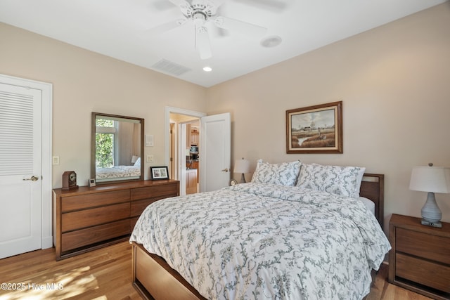 bedroom featuring ceiling fan and light wood-type flooring