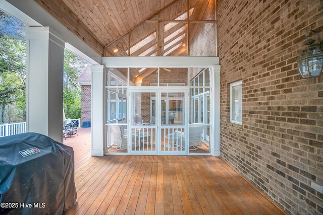 wooden terrace featuring a grill