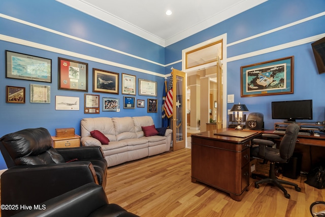 office area featuring crown molding, light hardwood / wood-style floors, and french doors