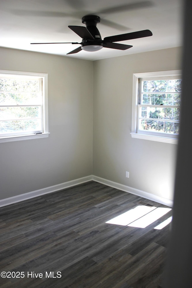 unfurnished room featuring ceiling fan and dark hardwood / wood-style flooring