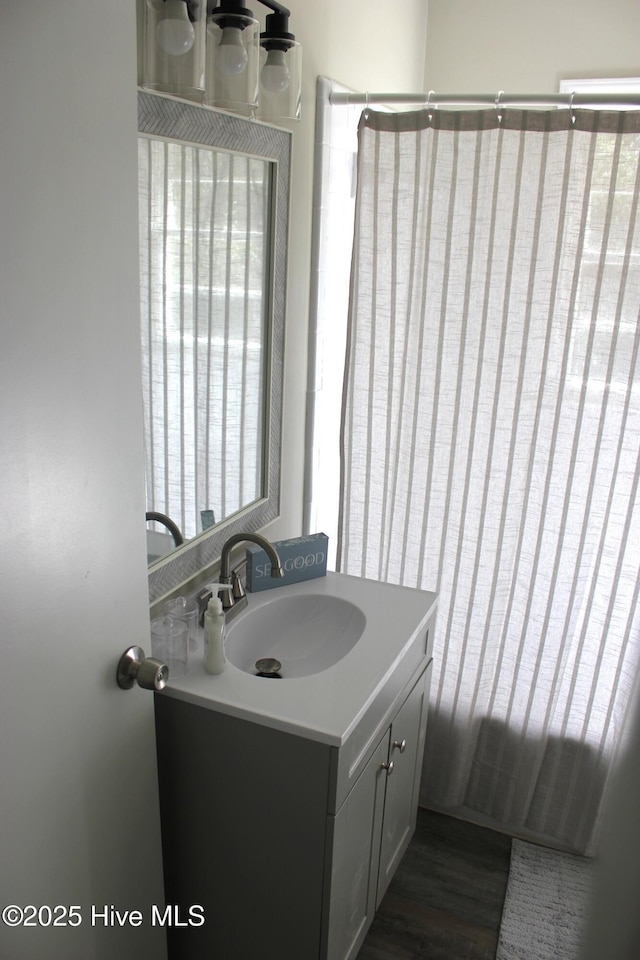 bathroom featuring hardwood / wood-style flooring and vanity