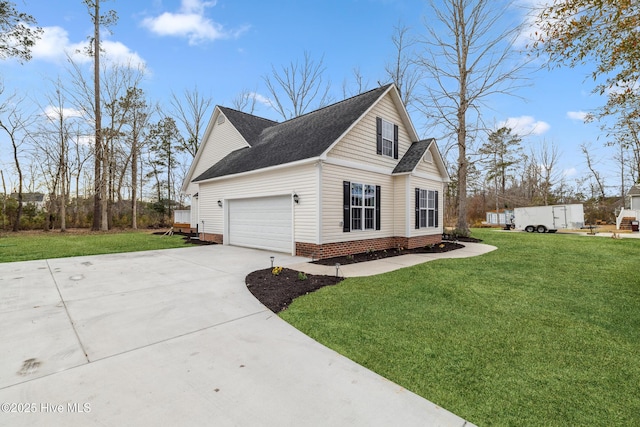 view of side of home featuring a garage and a yard