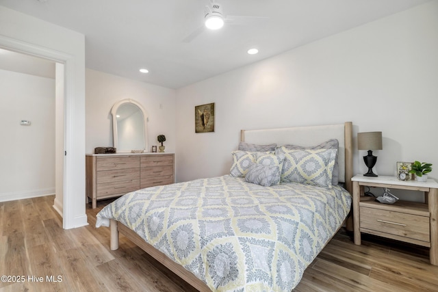 bedroom featuring ceiling fan and hardwood / wood-style floors