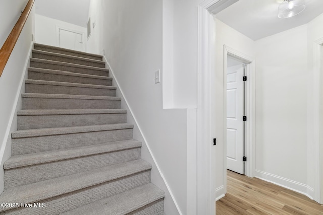 stairway with wood-type flooring