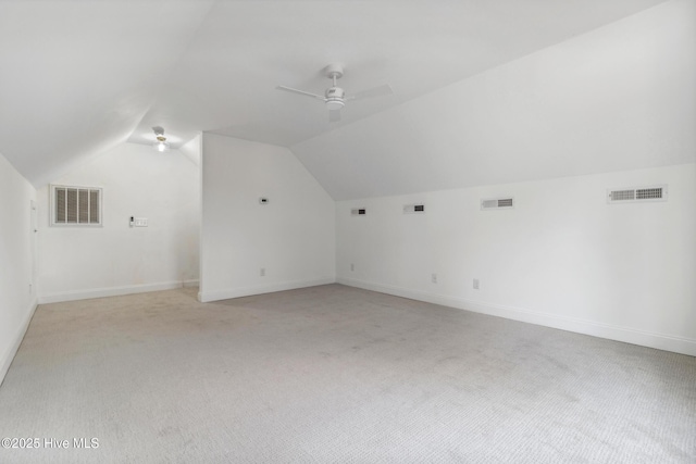 bonus room featuring lofted ceiling, light colored carpet, and ceiling fan