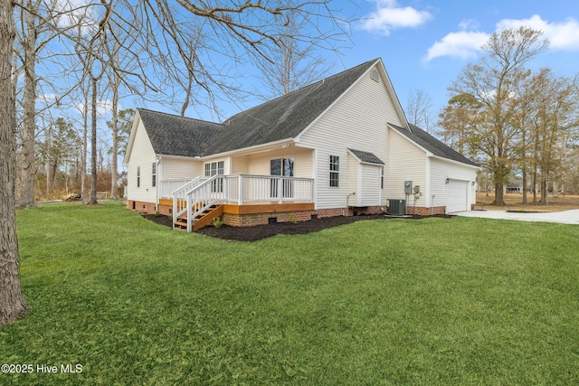 view of side of home featuring a garage, a wooden deck, a yard, and central AC